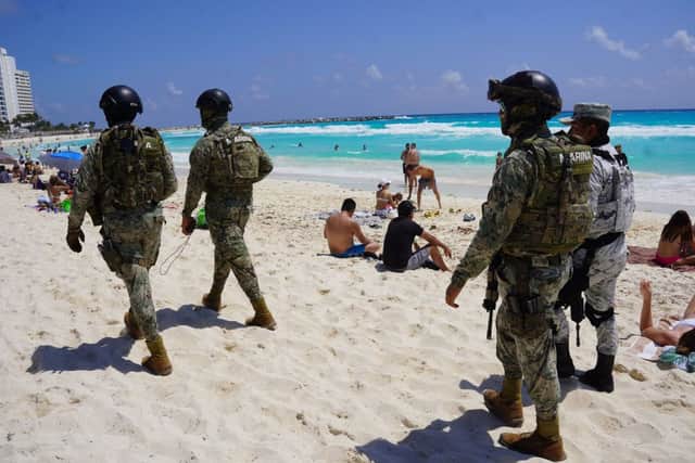 Mexican Navy and National Guard members patrol the tourist beach area of Cancun, as US "spring-breakers" flock to the Mexican Caribbean despite warnings from Washington of a wave of attacks on US citizens (Photo by ELIZABETH RUIZ/AFP via Getty Images)