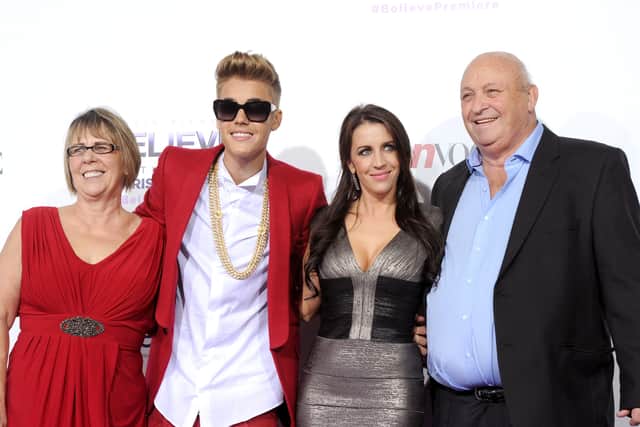 LOS ANGELES, CA - DECEMBER 18:  (L-R) Diane Dale, singer/producer Justin Bieber, Pattie Mallette and Bruce Dale arrive at the premiere Of Open Road Films' "Justin Bieber's Believe"  at Regal Cinemas L.A. Live on December 18, 2013 in Los Angeles, California.  (Photo by Kevin Winter/Getty Images)