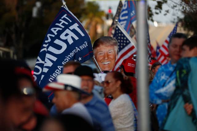 Supporters of former U.S. President Donald Trump, gather near his residence at the Mar-a-Lago Club on April 4, 2023 in West Palm Beach, Florida.  (Photo by Octavio Jones/Getty Images)