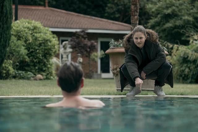 Ria Zmitrowicz as Roxy Monke in The Power, preparing to electrocute a man in a swimming pool (Credit: Ludovic Robert/Amazon Prime Video)