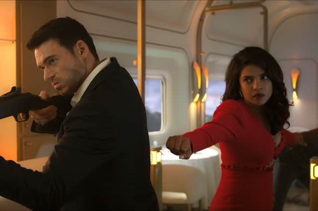 Richard Madden as Mason Kane and Priyanka Chopra Jonas as Nadia Sinh in Citadel, preparing for a fight in a train carriage (Credit: Amazon Prime Video)