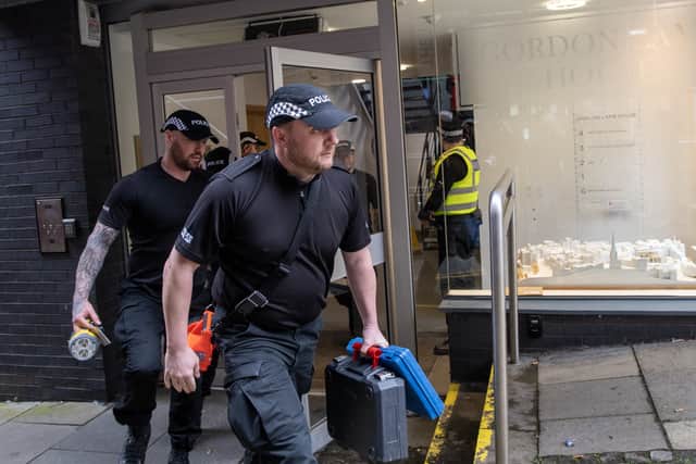 Officers from Police Scotland outside the headquarters of the Scottish National Party (SNP) in Edinburgh following the arrest of former chief executive Peter Murrell. Picture date: Wednesday April 5, 2023. Credit: PA