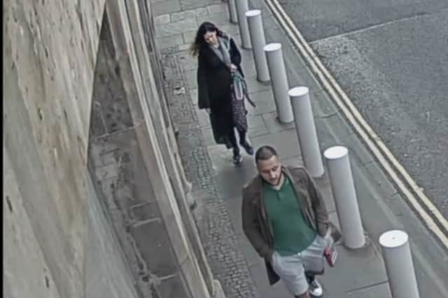 Handout photo dated 02/09/21 issued by the The Crown Office and Procurator Fiscal Service (COPFS) of Kashif Anwar, 29, from Leeds (front) followed by his wife Fawziyah Javed, 31, at 7.10pm on High St at the Scottish Parliament in Edinburgh