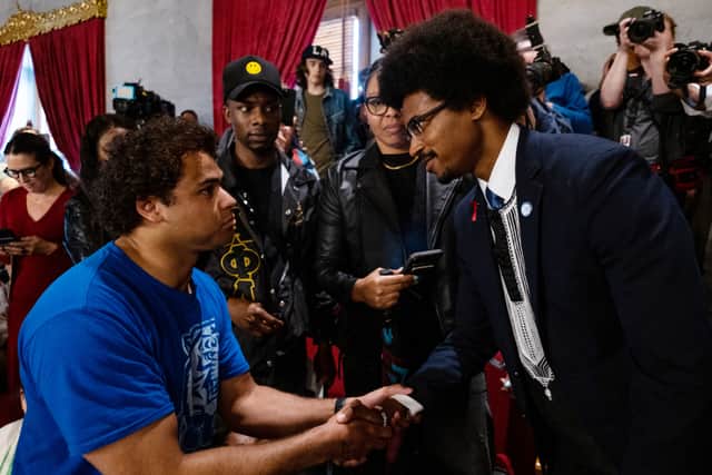 Democratic state Rep. Justin Pearson (R) of Memphis shakes hands with a supporter.  (Photo by Seth Herald/Getty Images)