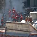 Firefighters move through the rubble at ‘rue Tivoli’ after a building collapsed in the street, in Marseille, southern France. Picture: CLEMENT MAHOUDEAU/AFP via Getty Images