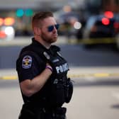 A police officer stands by at an active shooter incident near the Old National Bank building on April 10, 2023 in Louisville, Kentucky (Image: Getty)