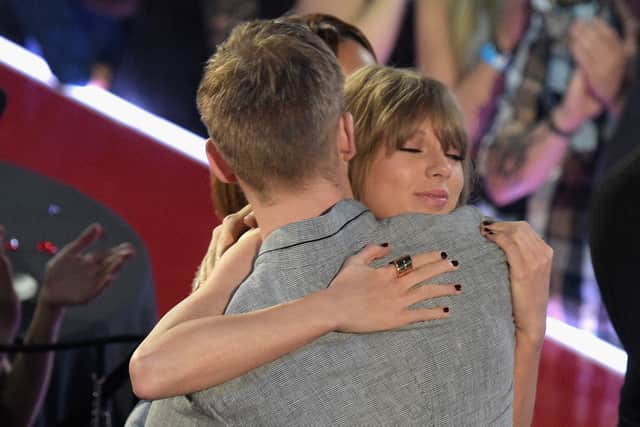 Taylor Swift (R) hugs Calvin Harris at the iHeartRadio Music Awards in 2016 (Photo: Jason Kempin/Getty Images for iHeartRadio / Turner)