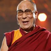 The Dalai Lama has reigned as the spiritual leader of Tibet since he was a young child. (Credit: Getty Images)