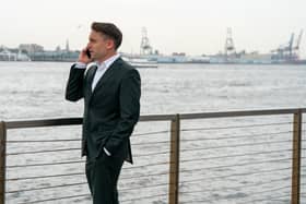 Kieran Culkin as Roman Roy in Succession Season 4 episode 3 'Connor's Wedding', taking a phone call on the dock (Credit: HBO)