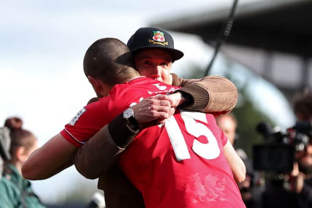 Rob McElhenney hugs Wrexham’s Eoghan O’Connell following win over Notts County