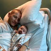 Adam Gray and his daughter Amelie both in hospital. Credit: Adam Gray / SWNS