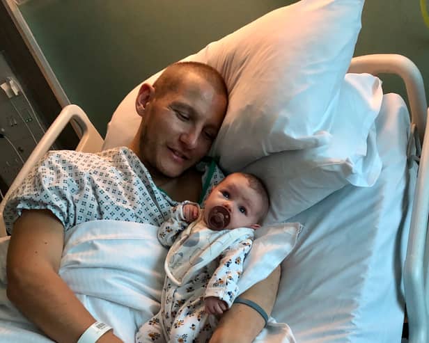 Adam Gray and his daughter Amelie both in hospital. Credit: Adam Gray / SWNS