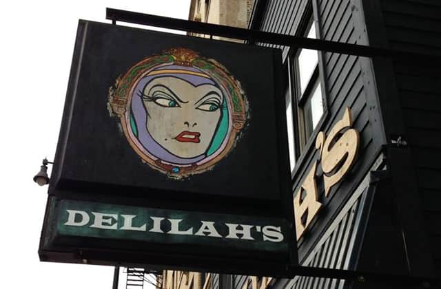 Delilah's has over 750 whiskey varietals, a pinball machine, and pool - a dive divine