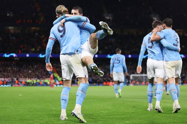 Bernardo Silva and Erling Haaland celebrate Manchester City’s win over Bayern