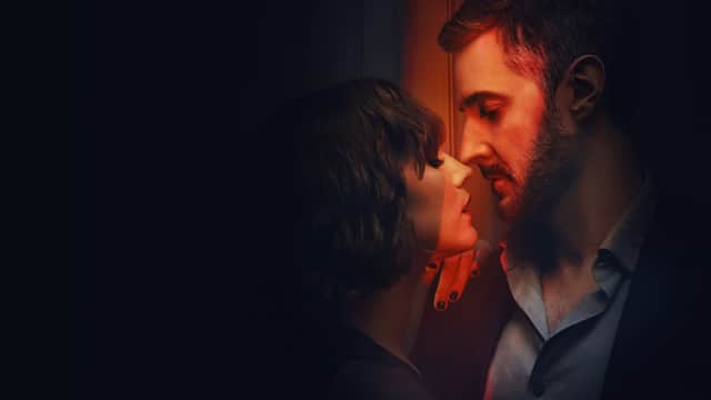 Charlie Murphy as Anna and Richard Armitage as William in Obsession, leaning in to embrace (Credit: Netflix)