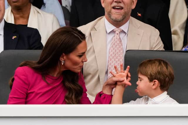 TOPSHOT - Britain's Catherine, Duchess of Cambridge, (L) and her son Britain's Prince Louis of Cambridge (R) react during the Platinum Pageant in London on June 5, 2022 as part of Queen Elizabeth II's platinum jubilee celebrations. - The curtain comes down on four days of momentous nationwide celebrations to honour Queen Elizabeth II's historic Platinum Jubilee with a day-long pageant lauding the 96-year-old monarch's record seven decades on the throne. (Photo by Frank Augstein / POOL / AFP) (Photo by FRANK AUGSTEIN/POOL/AFP via Getty Images)