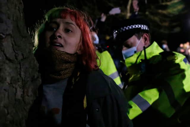 A woman is arrested during a vigil for Sarah Everard on Clapham Common on 13 March, 2021, in London, United Kingdom. Credit: Getty Images.