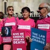 Supporters of Noel Conway from the campaign group Dignity in Dying stand with placards outside the Royal Courts of Justice, Strand on July 17, 2017 in London, England. (Photo by Jack Taylor/Getty Images)