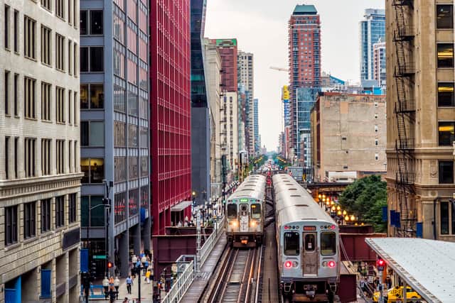 Elevated Train Tracks above the streets and between buildings at The Loop - Chicago, Illinois, USA