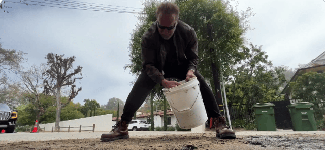 Terminator actor Arnold Schwarzenegger has filled what he belived to be a pothole in Brentwood, Los Angeles. Photo by Twitter/ Arnold Schwarzenegger.