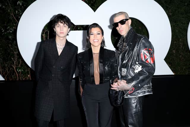 WEST HOLLYWOOD, CALIFORNIA - NOVEMBER 17: (L-R) Landon Barker, Kourtney Kardashian Barker, and Travis Barker attend the GQ Men of the Year Party 2022 at The West Hollywood EDITION on November 17, 2022 in West Hollywood, California. (Photo by Phillip Faraone/Getty Images for GQ)