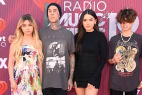 Alabama Barker, Travis Barker, Atiana De La Hoya, and guest attend the 2019 iHeartRadio Music Awards 