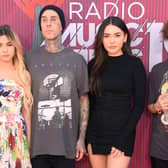 Alabama Barker, Travis Barker, Atiana De La Hoya, and guest attend the 2019 iHeartRadio Music Awards 