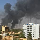 Smoke billows above residential buildings in Khartoum on April 16, 2023. Picture: AFP via Getty Images