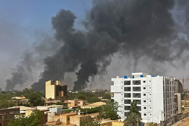 Smoke billows above residential buildings in Khartoum on April 16, 2023. Picture: AFP via Getty Images