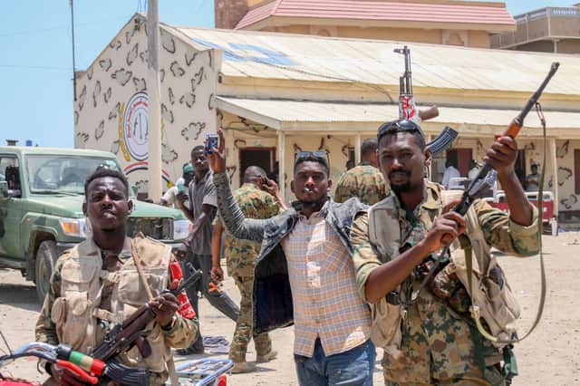 Sudanese army soldiers, loyal to army chief Abdel Fattah al-Burhan, pose for a picture at the Rapid Support Forces (RSF) base in the Red Sea city of Port Sudan (Photo: -/AFP via Getty Images)