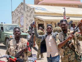 Sudanese army soldiers, loyal to army chief Abdel Fattah al-Burhan, pose for a picture at the Rapid Support Forces (RSF) base in the Red Sea city of Port Sudan (Photo: -/AFP via Getty Images)
