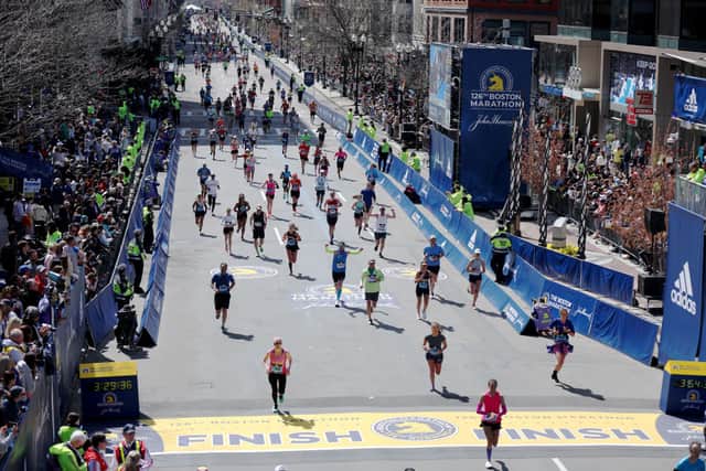 Runnings make their way down Boylston street to the finish line during the 126th Boston Marathon on April 18, 2022 in Boston, Massachusetts. (Photo by Omar Rawlings/Getty Images)