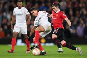 United goalscorer Marcel Sabitzer tackles Sevilla’s Erik Lamela in quarter-final first leg