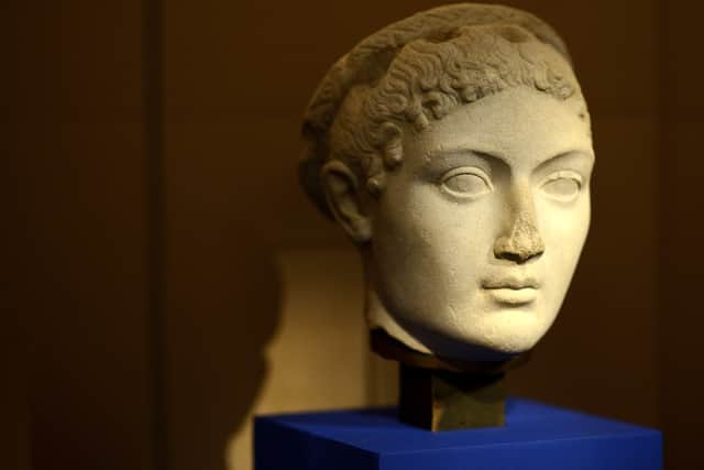 An ancient head of a statue depicting Cleopatra
