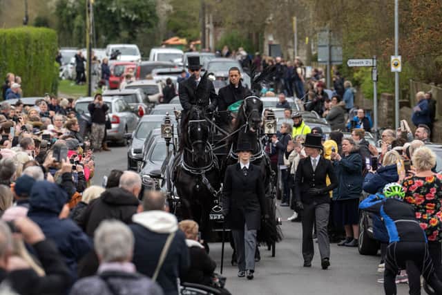 Paul O'Grady's funeral procession was met by hundreds of fans and dogs (Pic:Getty)