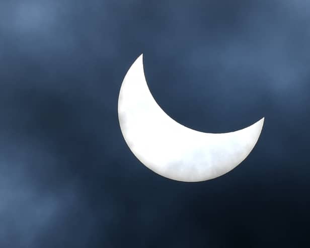 A general view shows a partial solar eclipse in Denpasar, on Indonesia's resort island of Bali on April 20, 2023. (Photo by SONNY TUMBELAKA / AFP) (Photo by SONNY TUMBELAKA/AFP via Getty Images)