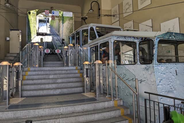 The second Funicular Città Alta carriage descends as passengers board the first, to ascend to the Città Alta
