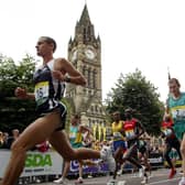 Manchester Marathon runners pass The Town Hall