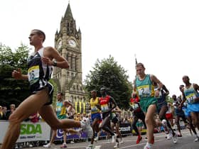 Manchester Marathon runners pass The Town Hall
