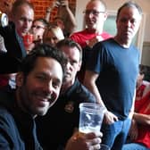 Paul Rudd alongside Wrexham fans in The Turf Pub ahead of the Vanarama National League match at The Racecourse Ground, Wrexham. 