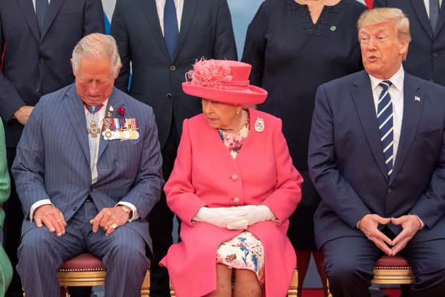 Britain's Prince Charles, Prince of Wales (L), Britain's Queen Elizabeth II and US President Donald Trump pose for the official family photograph during an event to commemorate the 75th anniversary of the D-Day landings, in Portsmouth, southern England, on June 5, 2019 (Credit: Getty Images)