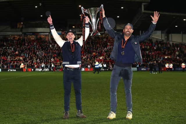 McElhenney and Reynolds lift the National League trophy on Saturday 