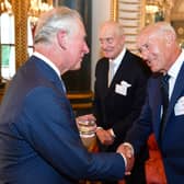 Prince Charles, Prince of Wales speaks to Charles Dance and Len Goodman and during a reception for Age UK at Buckingham Palace on June 6, 2018 in London, England. (Photo by John Stillwell -WPA Pool/Getty Images)
