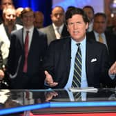 Fox News says it has parted ways with controversial host Tucker Carlson days after settling a high-profile lawsuit (Photo by Jason Koerner/Getty Images)