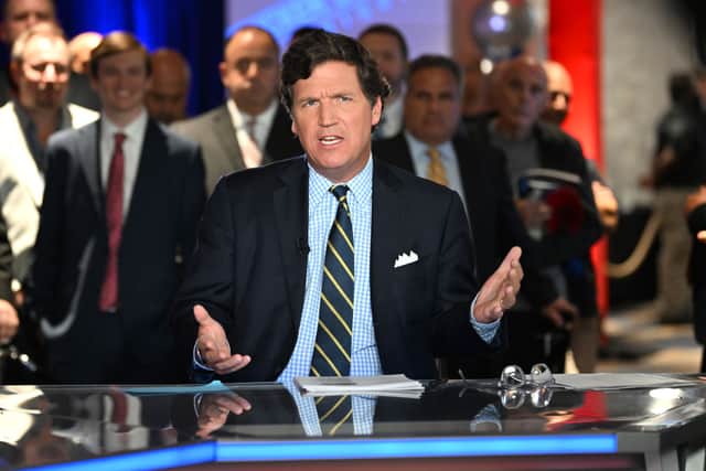 Fox News says it has parted ways with controversial host Tucker Carlson days after settling a high-profile lawsuit (Photo by Jason Koerner/Getty Images)