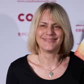 Kate Saunders poses with her Children’s Award winning book ‘Five Children on the Western Front’ in 2015 (Photo: JUSTIN TALLIS/AFP via Getty Images)