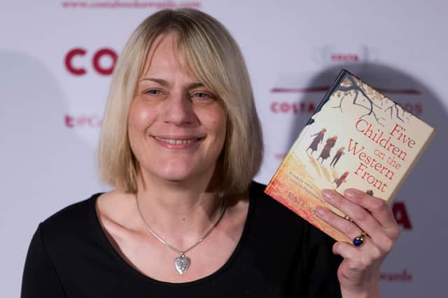 Kate Saunders poses with her Children’s Award winning book ‘Five Children on the Western Front’ in 2015 (Photo: JUSTIN TALLIS/AFP via Getty Images)