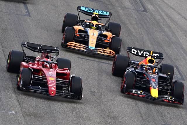 Charles Leclerc (L), Max Verstappen (R) and Lando Norris during sprint race in Italy 2022