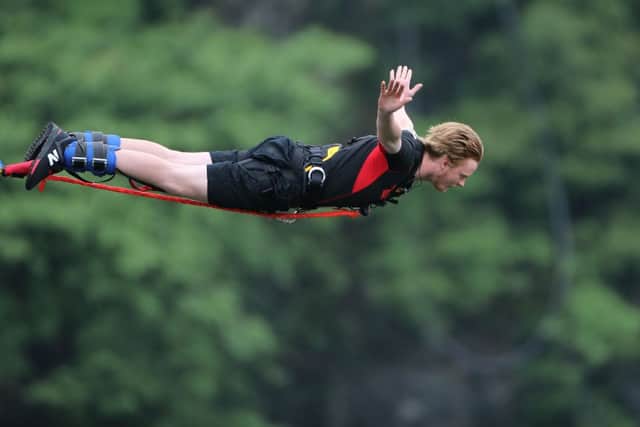 You need specific travel insurance if you want to go bungee jumping on holiday (image: Getty Images)