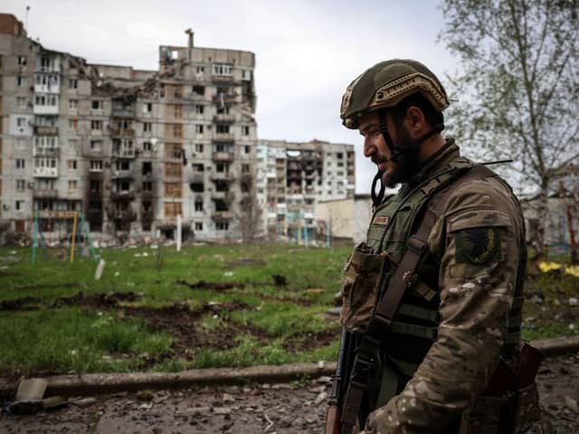A Ukrainian soldier walks through Bakhmut on 23 April (image: AFP/Getty Images)